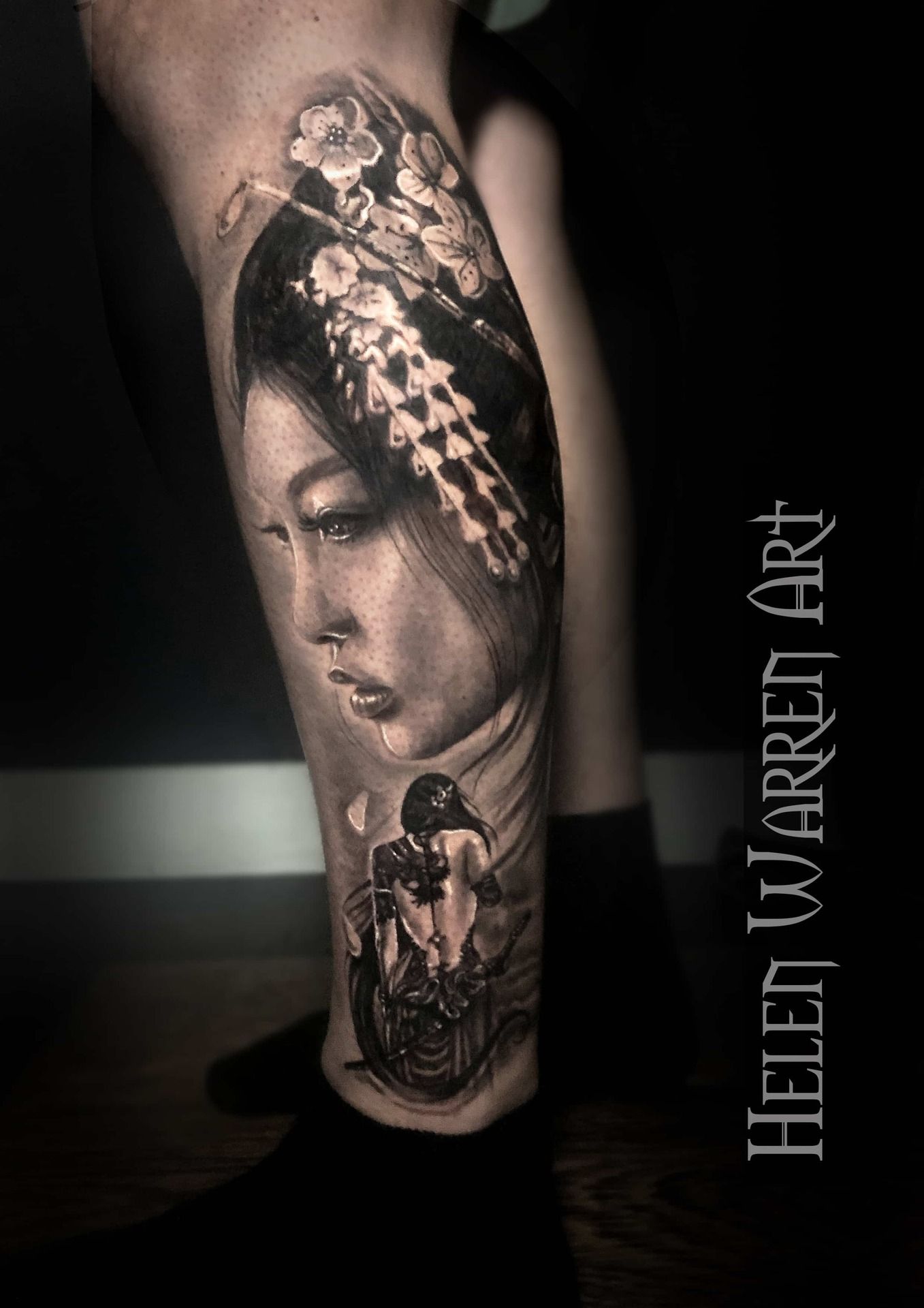 Black and white leg tattoo: a woman's face, floral headdress, and a lower torso image.